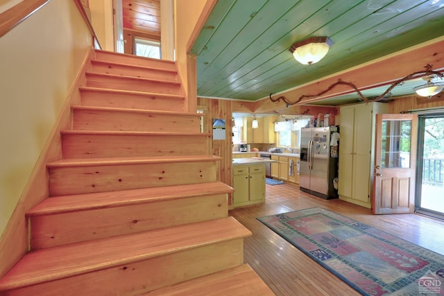 630 County Route 11, Ancram, NY 12502 - staircase with wood ceiling, hardwood / wood-style flooring, and wood walls
