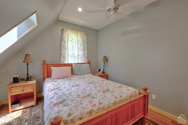 630 County Route 11, Ancram, NY 12502 - bedroom with wood finished floors, lofted ceiling, a skylight, baseboards, and recessed lighting