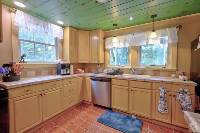 630 County Route 11, Ancram, NY 12502 - kitchen featuring stainless steel dishwasher, a sink, plenty of natural light, tile counters, and recessed lighting