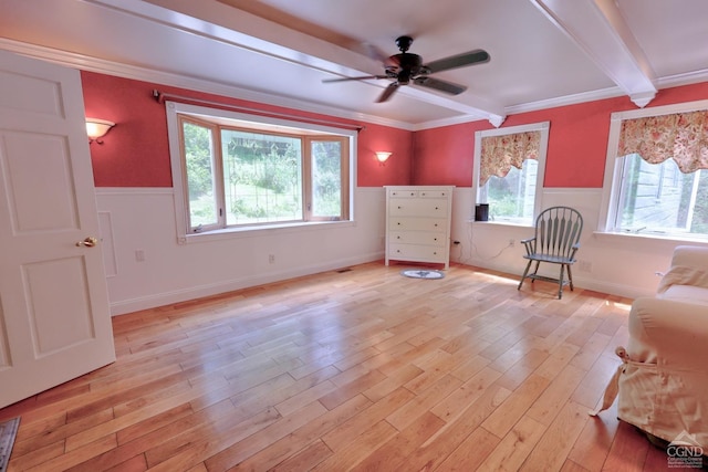 630 County Route 11, Ancram, NY 12502 - sitting room featuring ceiling fan, light wood-style floors, beam ceiling, a wainscoted wall, and crown molding