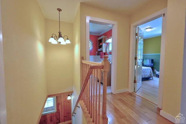 630 County Route 11, Ancram, NY 12502 - hallway featuring an upstairs landing, a chandelier, and light wood-style flooring