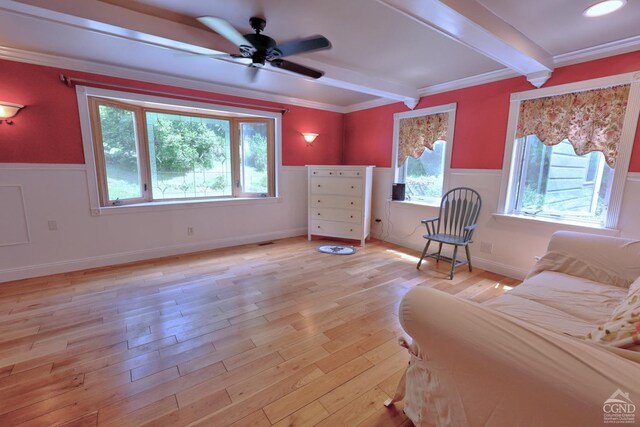 630 County Route 11, Ancram, NY 12502 - bedroom with beam ceiling, multiple windows, wainscoting, light wood finished floors, and crown molding