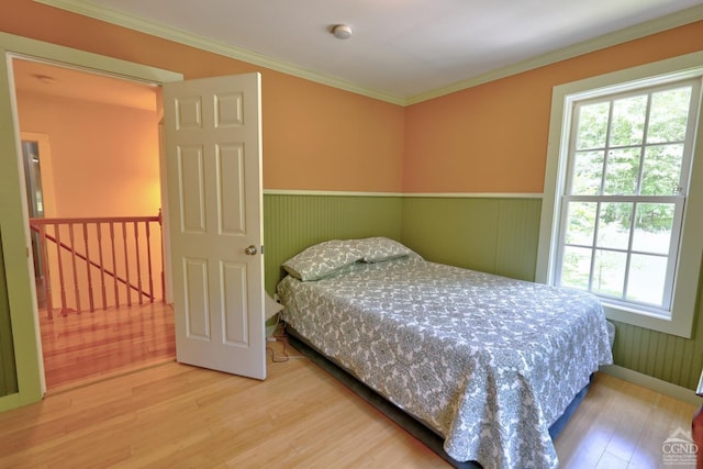 630 County Route 11, Ancram, NY 12502 - bedroom with wood finished floors, multiple windows, wainscoting, and ornamental molding