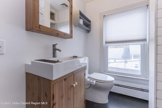 half bath with a baseboard radiator, visible vents, toilet, and vanity