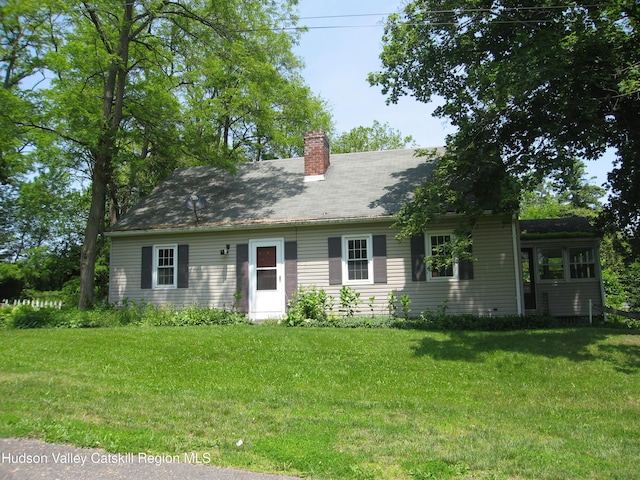 12 Fabiano Blvd, Hudson, NY 12534 - view of front facade featuring a chimney and a front yard