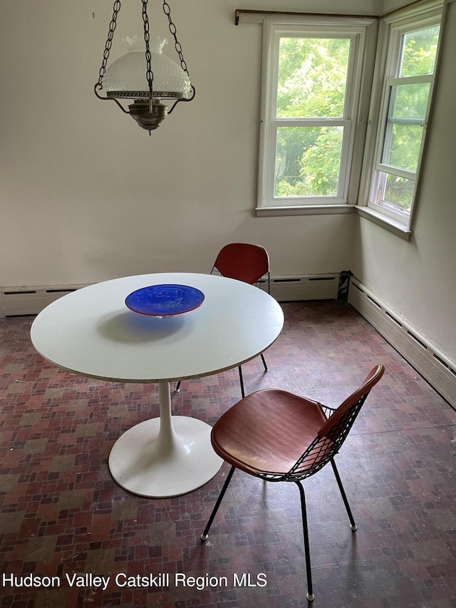 12 Fabiano Blvd, Hudson, NY 12534 - dining space with a baseboard heating unit and healthy amount of natural light