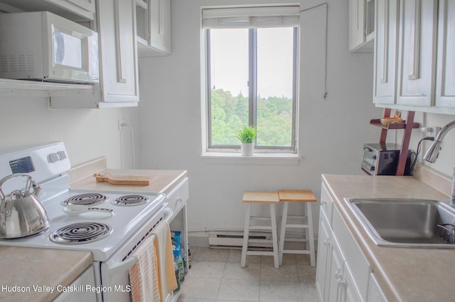 160 Academy St, Poughkeepsie, NY 12601 - kitchen with white appliances, light countertops, a sink, and healthy amount of natural light