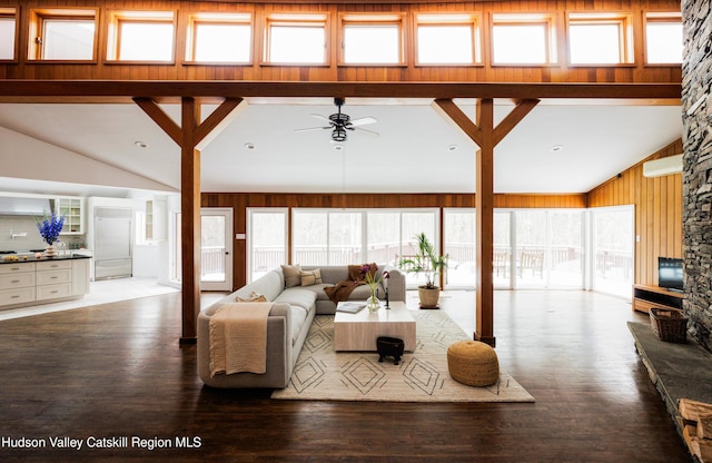 living room featuring ceiling fan, hardwood / wood-style floors, and high vaulted ceiling