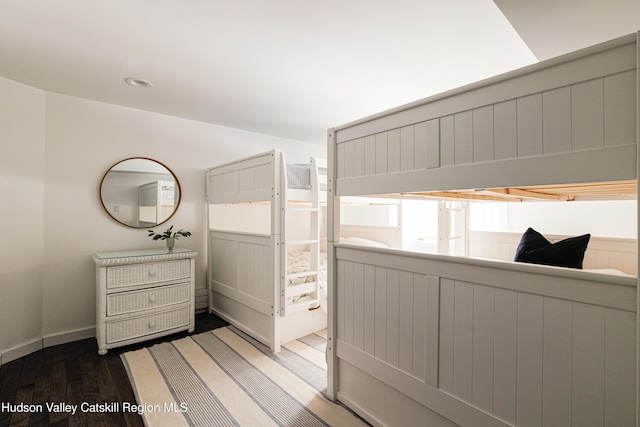 bedroom featuring dark hardwood / wood-style flooring