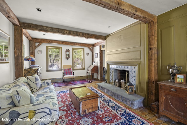455 Post Hill Rd, Craryville, NY 12534 - living area featuring beam ceiling, plenty of natural light, and a fireplace with raised hearth