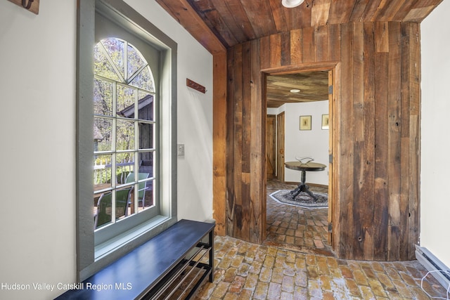 455 Post Hill Rd, Craryville, NY 12534 - hall with wooden ceiling, healthy amount of natural light, wooden walls, brick floors, and baseboard heating