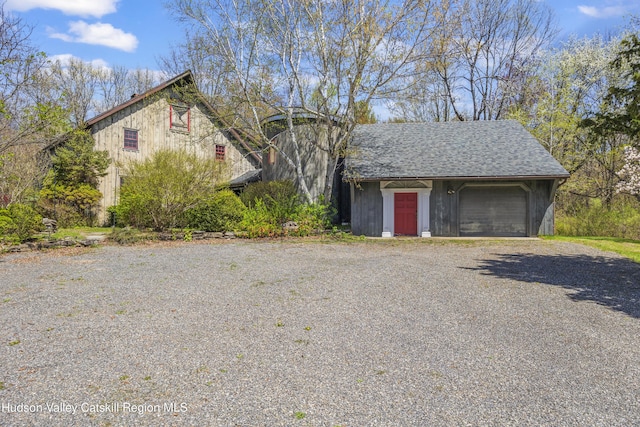 455 Post Hill Rd, Craryville, NY 12534 - view of side of property with gravel driveway, a garage, and an outdoor structure