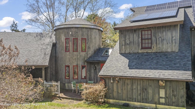 455 Post Hill Rd, Craryville, NY 12534 - view of property exterior featuring solar panels and a shingled roof