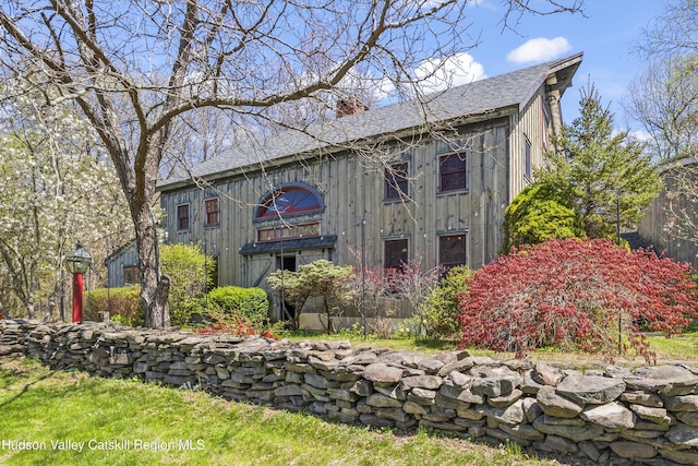 455 Post Hill Rd, Craryville, NY 12534 - view of front of home with a chimney, a shingled roof, and board and batten siding