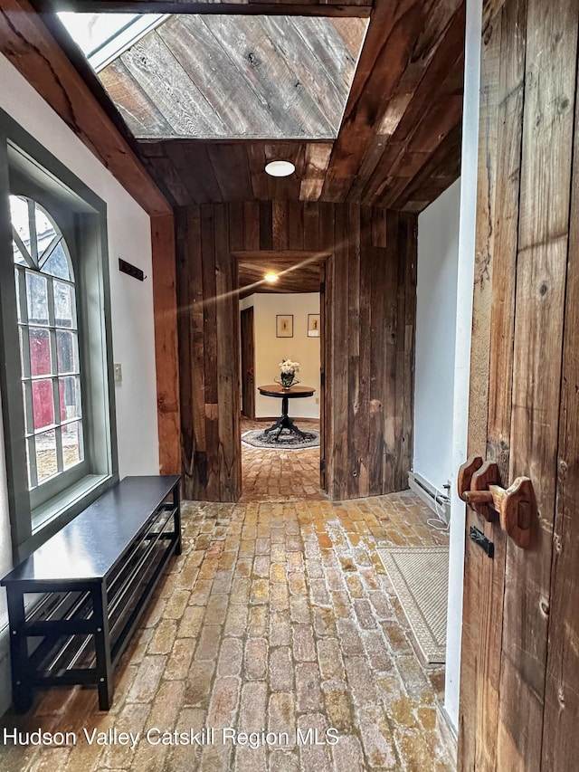 455 Post Hill Rd, Craryville, NY 12534 - hallway featuring wooden walls, brick floors, and wood ceiling