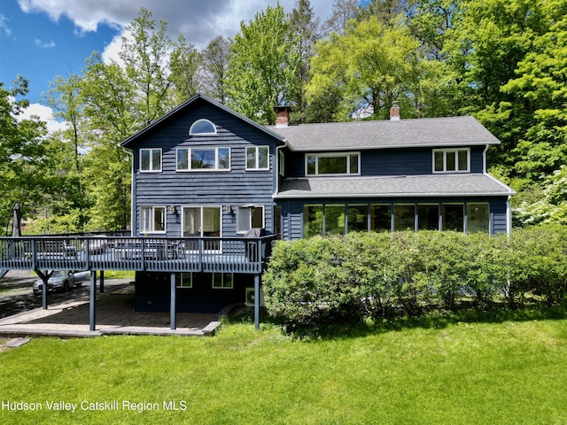 94 The Middle Way, Mount Tremper, NY 12457 - back of house featuring a wooden deck, a chimney, a yard, and a shingled roof