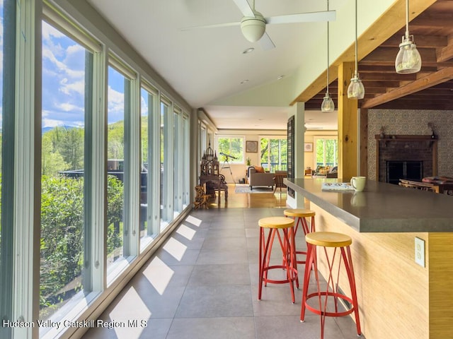 94 The Middle Way, Mount Tremper, NY 12457 - sunroom featuring tile patterned flooring and vaulted ceiling