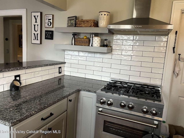 797 State Route 203, Spencertown, NY 12165 - kitchen featuring wall chimney exhaust hood, high end stainless steel range oven, open shelves, tasteful backsplash, and dark stone counters