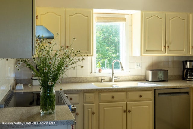 17 Stephen Dr, Hudson, NY 12534 - kitchen with stainless steel dishwasher, backsplash, and light countertops