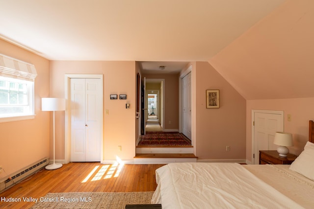 17 Stephen Dr, Hudson, NY 12534 - bedroom with baseboard heating, wood finished floors, and multiple closets