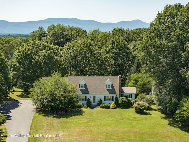 17 Stephen Dr, Hudson, NY 12534 - view of front of property with a front lawn, a mountain view, and a chimney