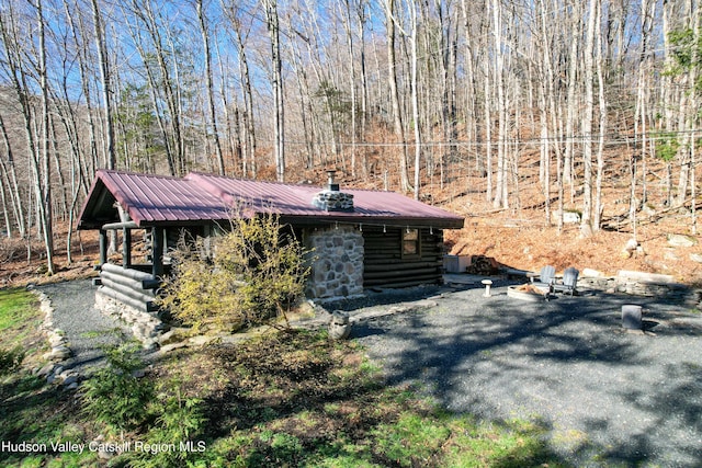 view of log cabin