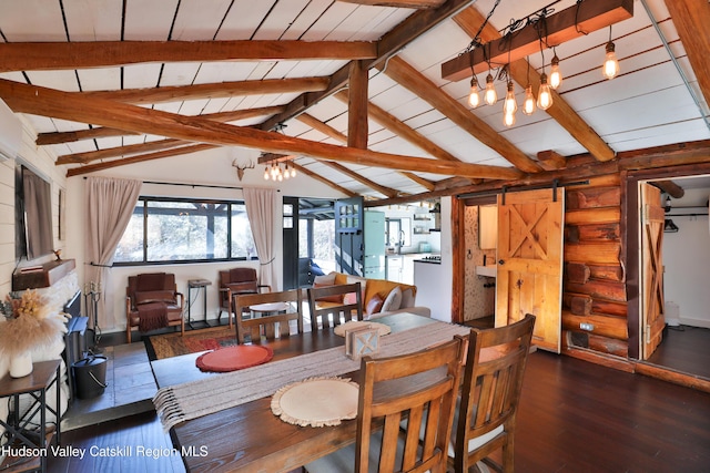 dining space with a barn door, lofted ceiling with beams, dark hardwood / wood-style floors, and an inviting chandelier