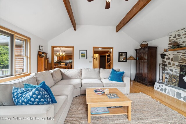552 Bearkill Rd, Gilboa, NY 12076 - living room with light wood finished floors, a ceiling fan, and a chandelier