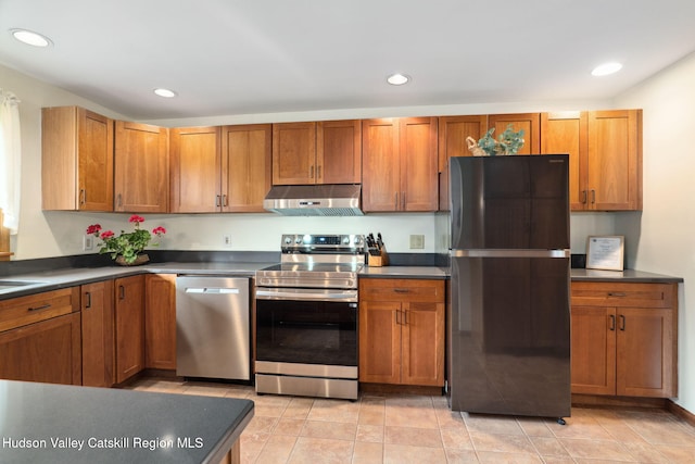 552 Bearkill Rd, Gilboa, NY 12076 - kitchen featuring appliances with stainless steel finishes, under cabinet range hood, dark countertops, recessed lighting, and brown cabinets