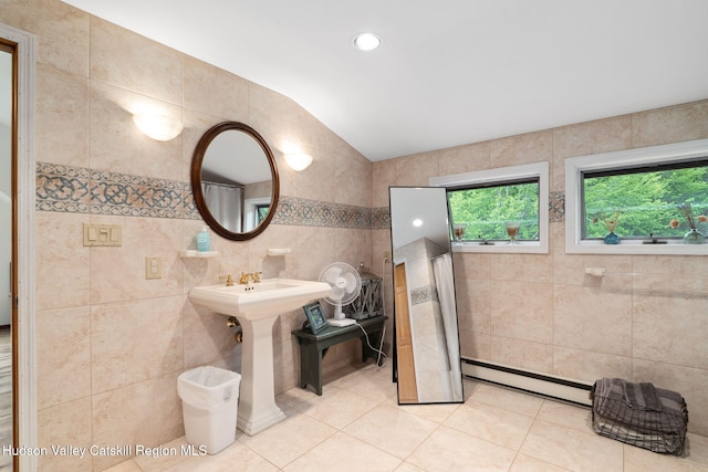 552 Bearkill Rd, Gilboa, NY 12076 - bathroom with a baseboard radiator, tile walls, lofted ceiling, and tile patterned flooring