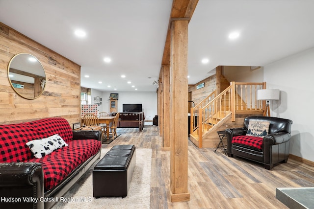 552 Bearkill Rd, Gilboa, NY 12076 - living room featuring wood walls, wood finished floors, stairs, and recessed lighting