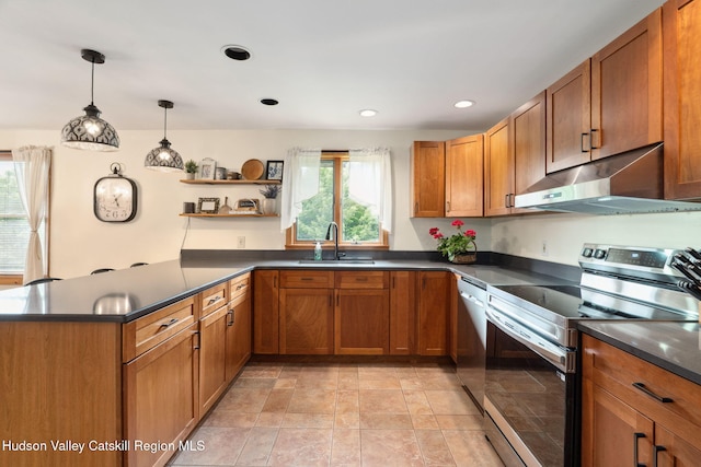 552 Bearkill Rd, Gilboa, NY 12076 - kitchen with appliances with stainless steel finishes, under cabinet range hood, dark countertops, brown cabinets, and recessed lighting