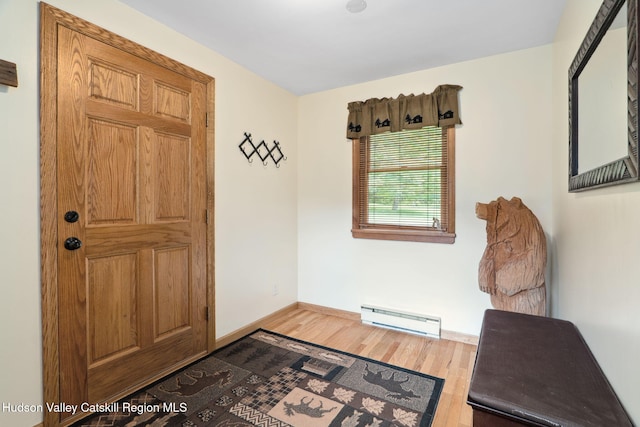 552 Bearkill Rd, Gilboa, NY 12076 - entrance foyer featuring baseboard heating and wood finished floors