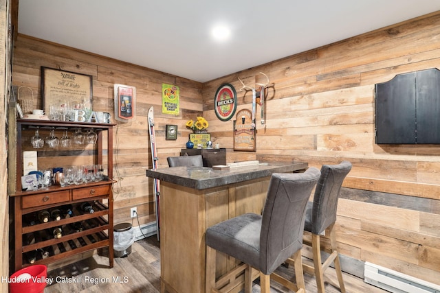552 Bearkill Rd, Gilboa, NY 12076 - indoor dry bar with wood walls, wood finished floors, and a baseboard heating unit