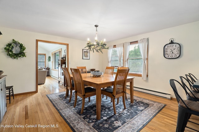 552 Bearkill Rd, Gilboa, NY 12076 - dining space with baseboard heating, a chandelier, and light wood-style flooring