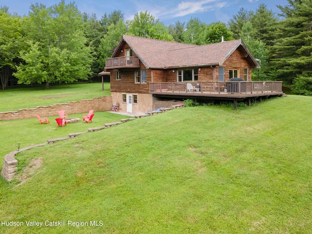 552 Bearkill Rd, Gilboa, NY 12076 - back of property with a lawn, a deck, and a fire pit