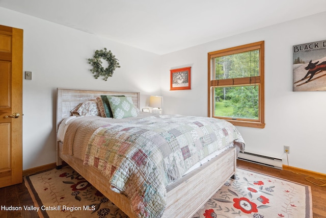 552 Bearkill Rd, Gilboa, NY 12076 - bedroom featuring a baseboard radiator and wood finished floors