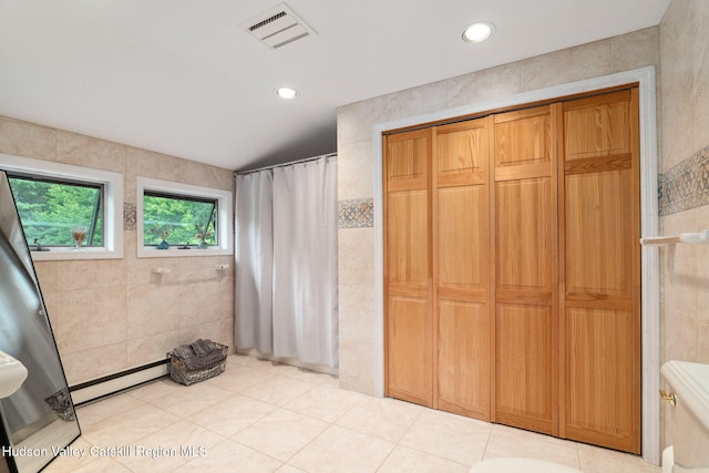 552 Bearkill Rd, Gilboa, NY 12076 - full bath featuring baseboard heating, tile walls, tile patterned floors, curtained shower, and recessed lighting