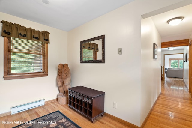 552 Bearkill Rd, Gilboa, NY 12076 - corridor with a baseboard heating unit and wood finished floors