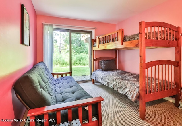 bedroom featuring carpet and access to outside