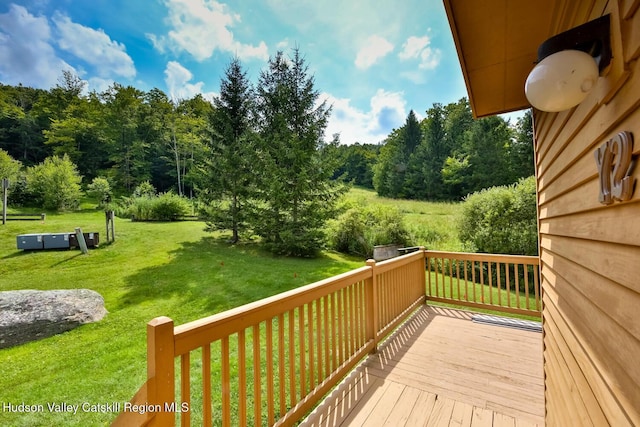 wooden deck with a yard