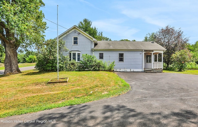 back of house with a yard