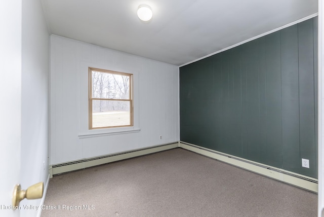 carpeted empty room with baseboard heating