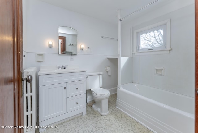 full bath with a bathtub, toilet, and vanity