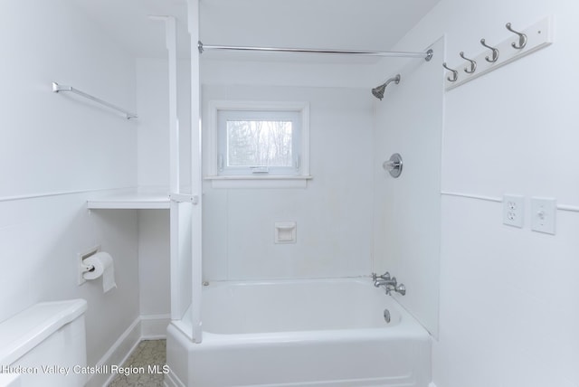 bathroom with toilet and shower / bathing tub combination