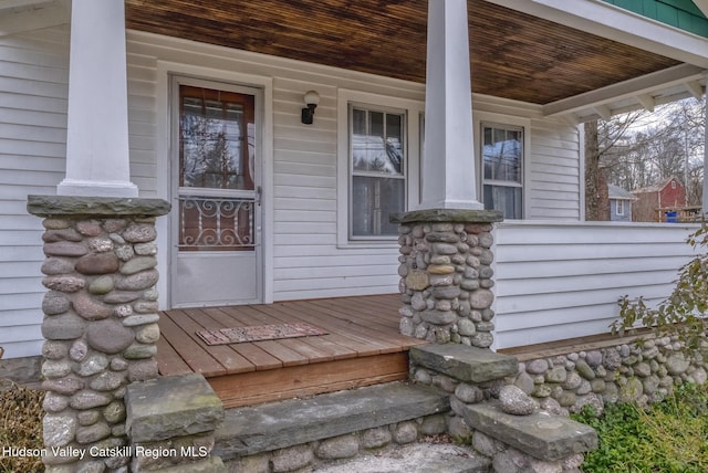 doorway to property featuring covered porch