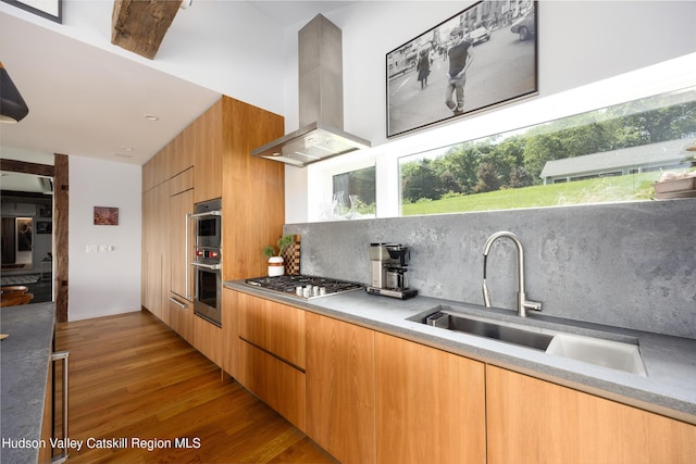64 Dug Rd, Accord, NY 12404 - kitchen featuring extractor fan, stainless steel appliances, modern cabinets, tasteful backsplash, and wood finished floors