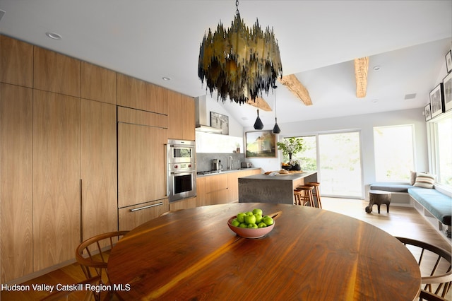 64 Dug Rd, Accord, NY 12404 - dining space featuring plenty of natural light, light wood-type flooring, and vaulted ceiling