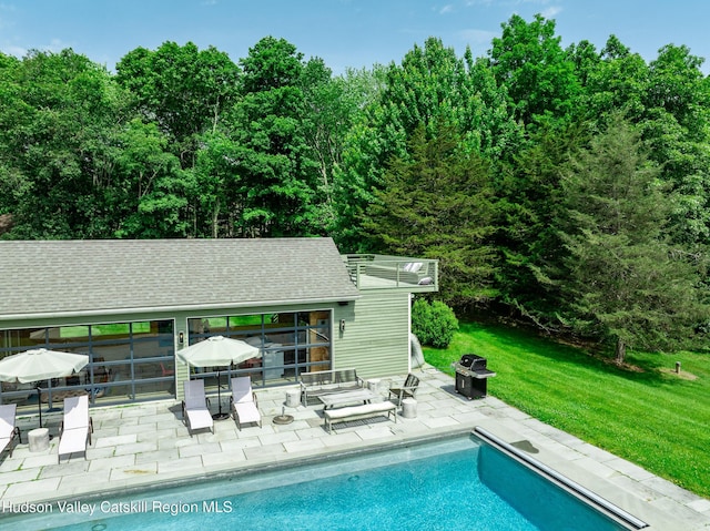 64 Dug Rd, Accord, NY 12404 - swimming pool featuring a patio, an exterior structure, an outdoor structure, a lawn, and area for grilling