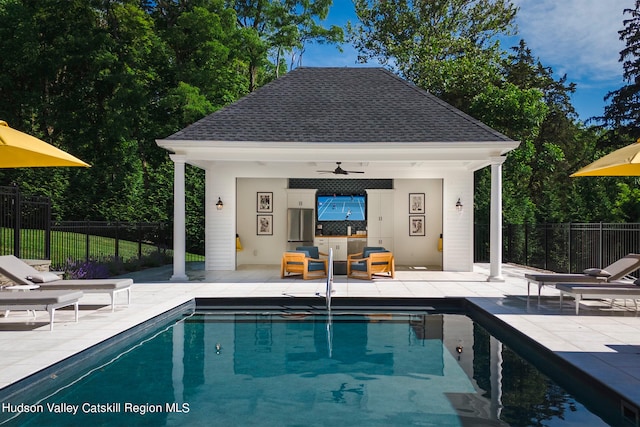 view of pool featuring an outdoor living space, ceiling fan, and a patio area